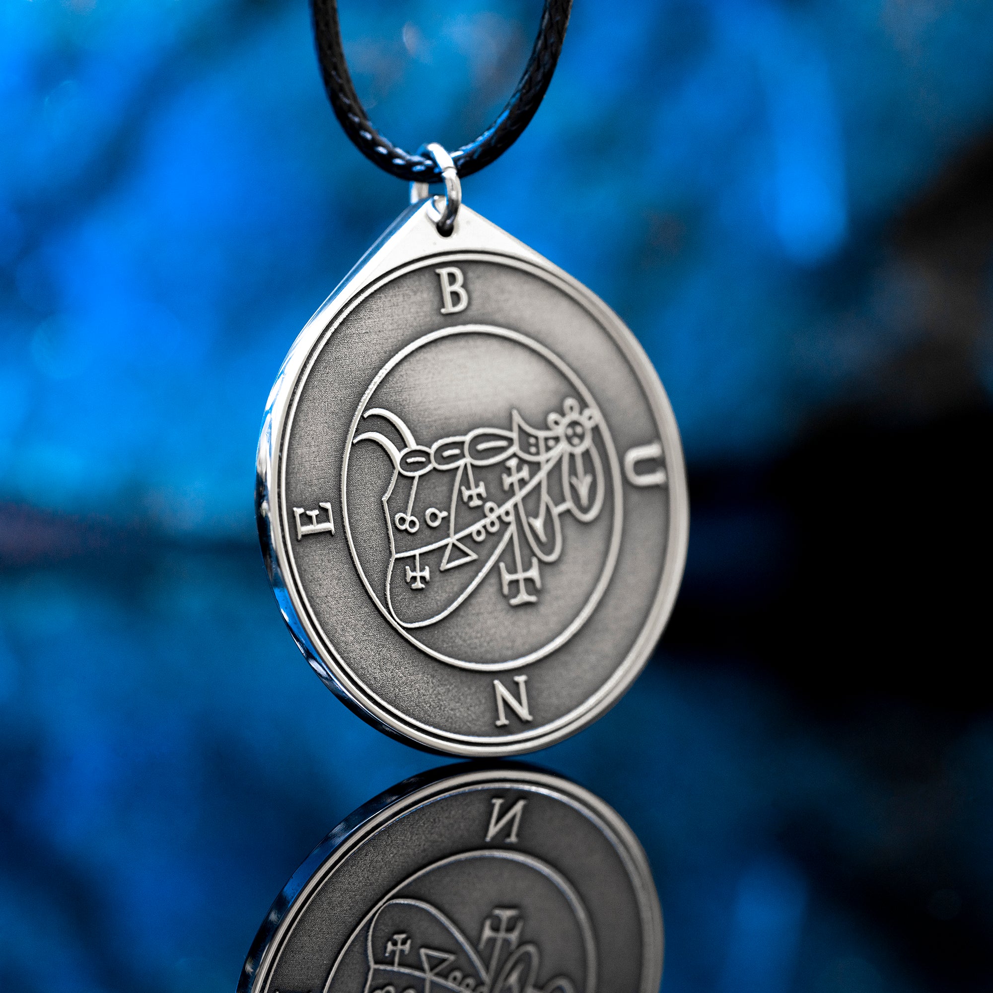 Bune seal pendant with Goetia demon sigil engraved on a dark occult amulet necklace