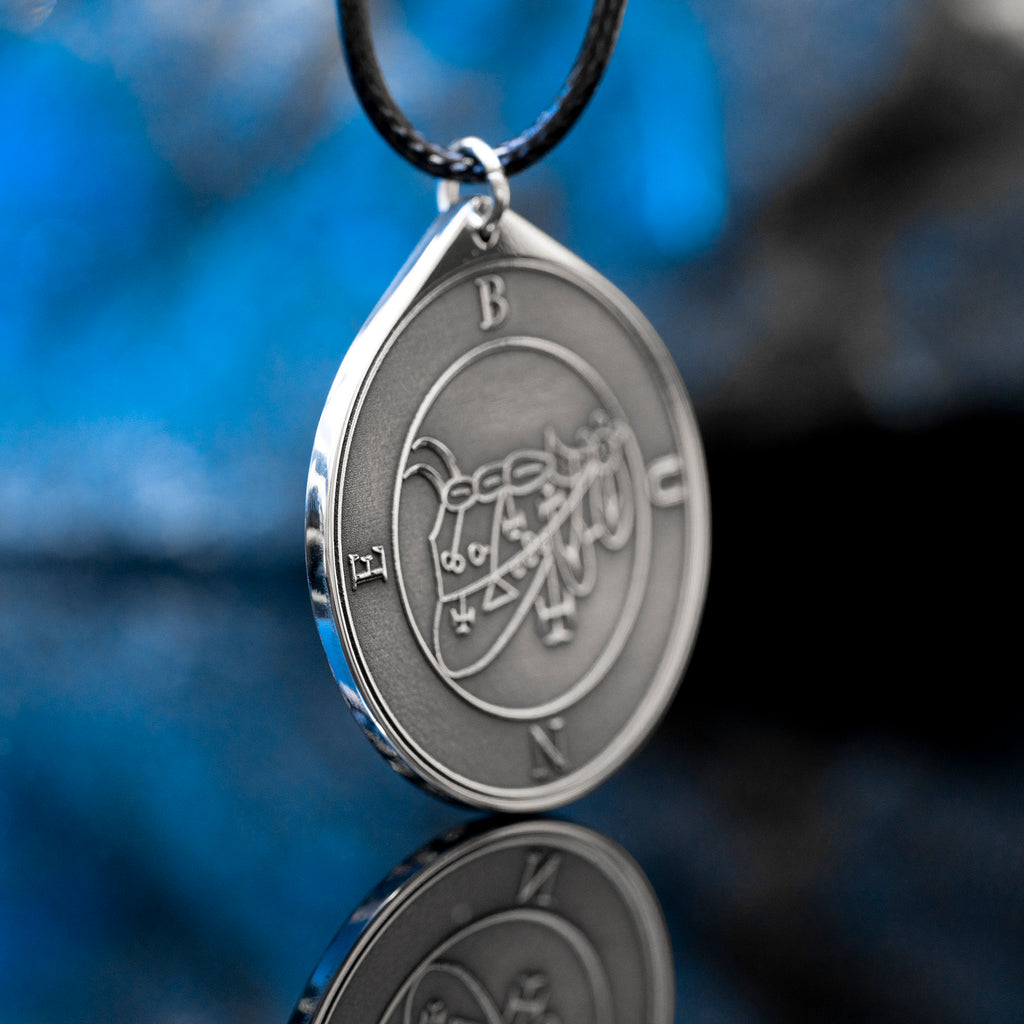 Bune seal pendant with Goetia demon sigil engraved on a dark occult amulet necklace