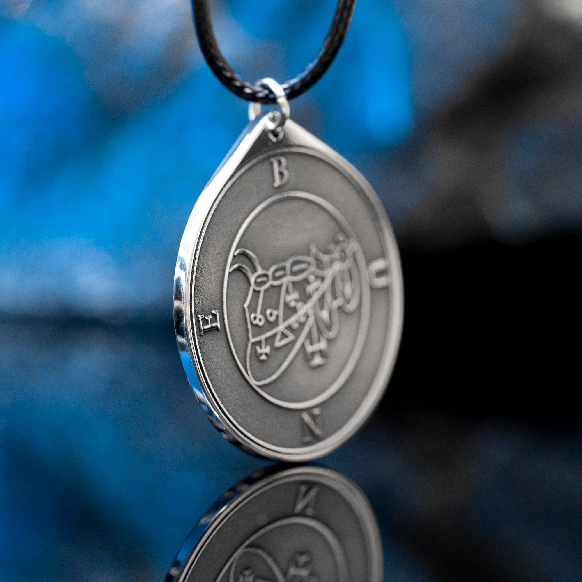 Bune seal pendant with Goetia demon sigil engraved on a dark occult amulet necklace
