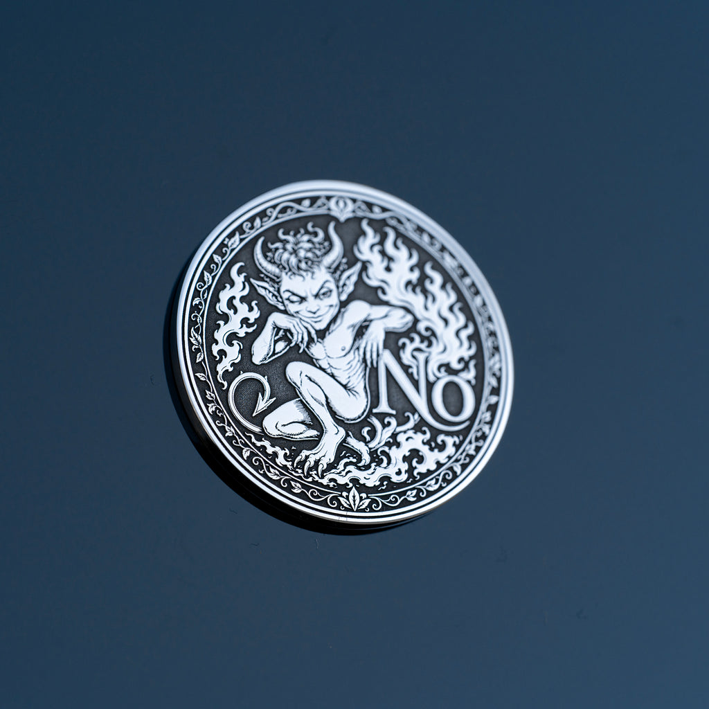 Double-sided fantasy decision coin with a nymph on the Yes side and an imp on the No side
