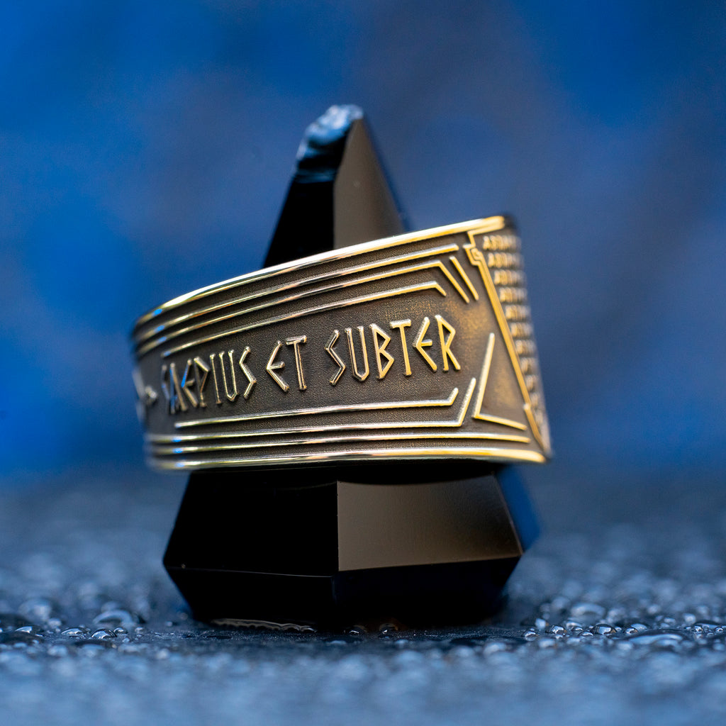 Abracadabra ring with diminishing triangle inscription, Latin spell phrases, ancient healing charm, and protection symbolism