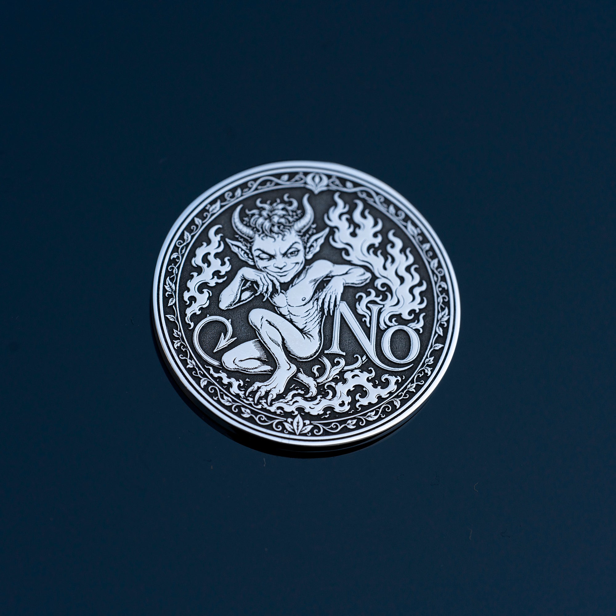 Double-sided fantasy decision coin with a nymph on the Yes side and an imp on the No side
