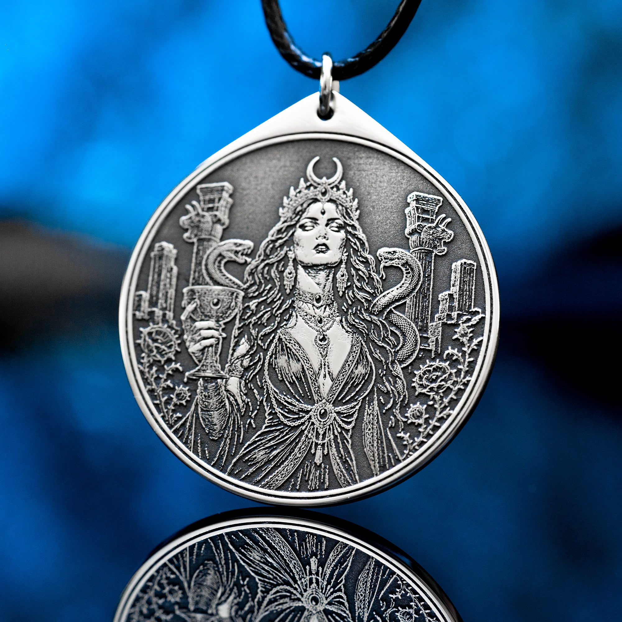 Az Jahi pendant with serpents, ritual chalice and crescent crown in black and white occult engraving style