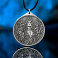 Az Jahi pendant with serpents, ritual chalice and crescent crown in black and white occult engraving style
