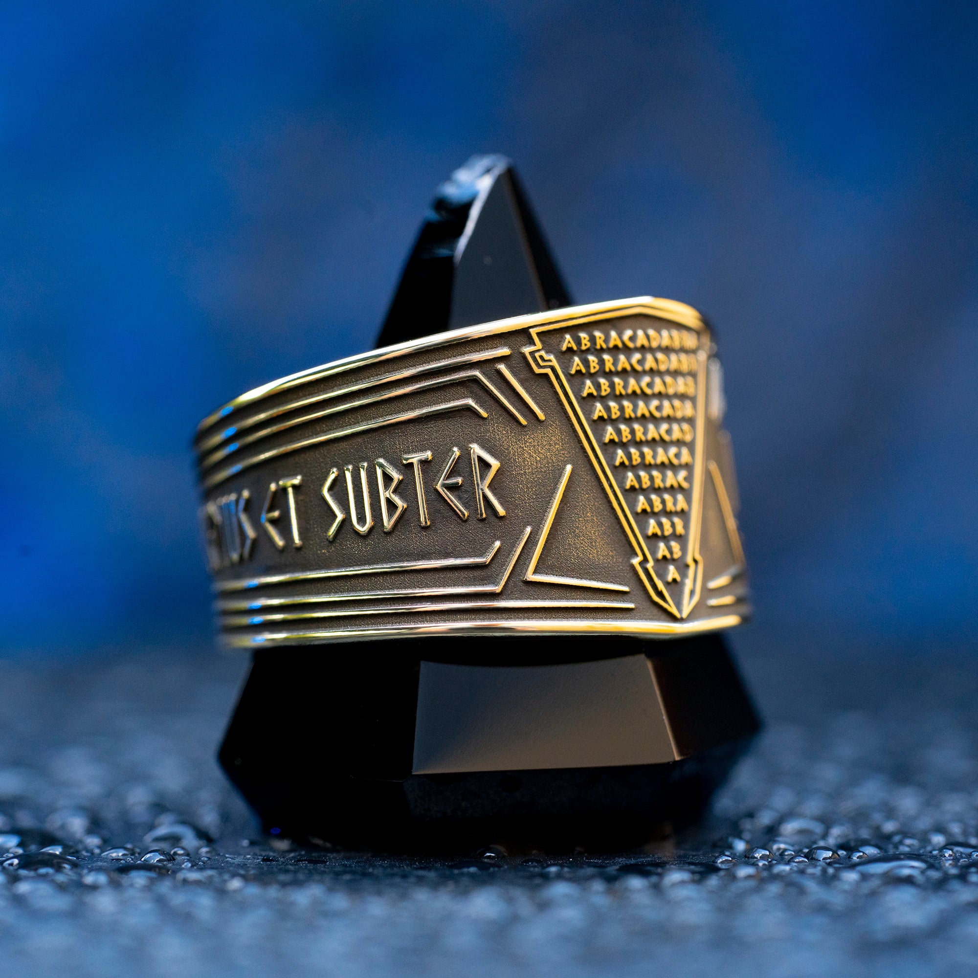 Abracadabra ring with diminishing triangle inscription, Latin spell phrases, ancient healing charm, and protection symbolism