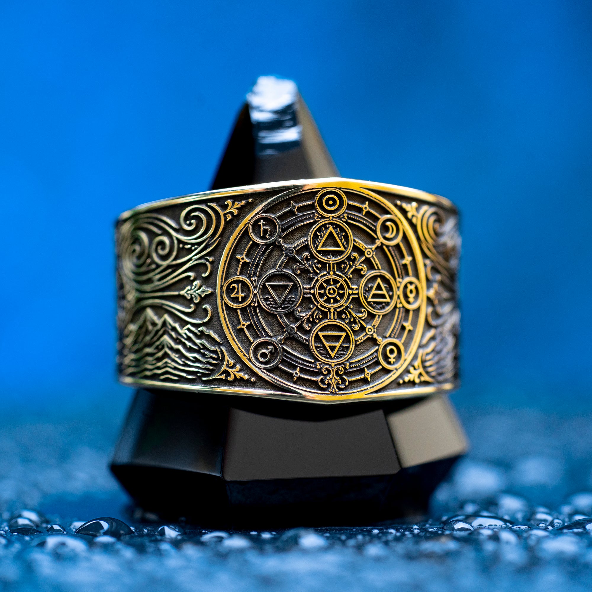 Gothic alchemical ring with Fire, Water, Air, Earth, seven planetary metal symbols, and detailed occult engraving