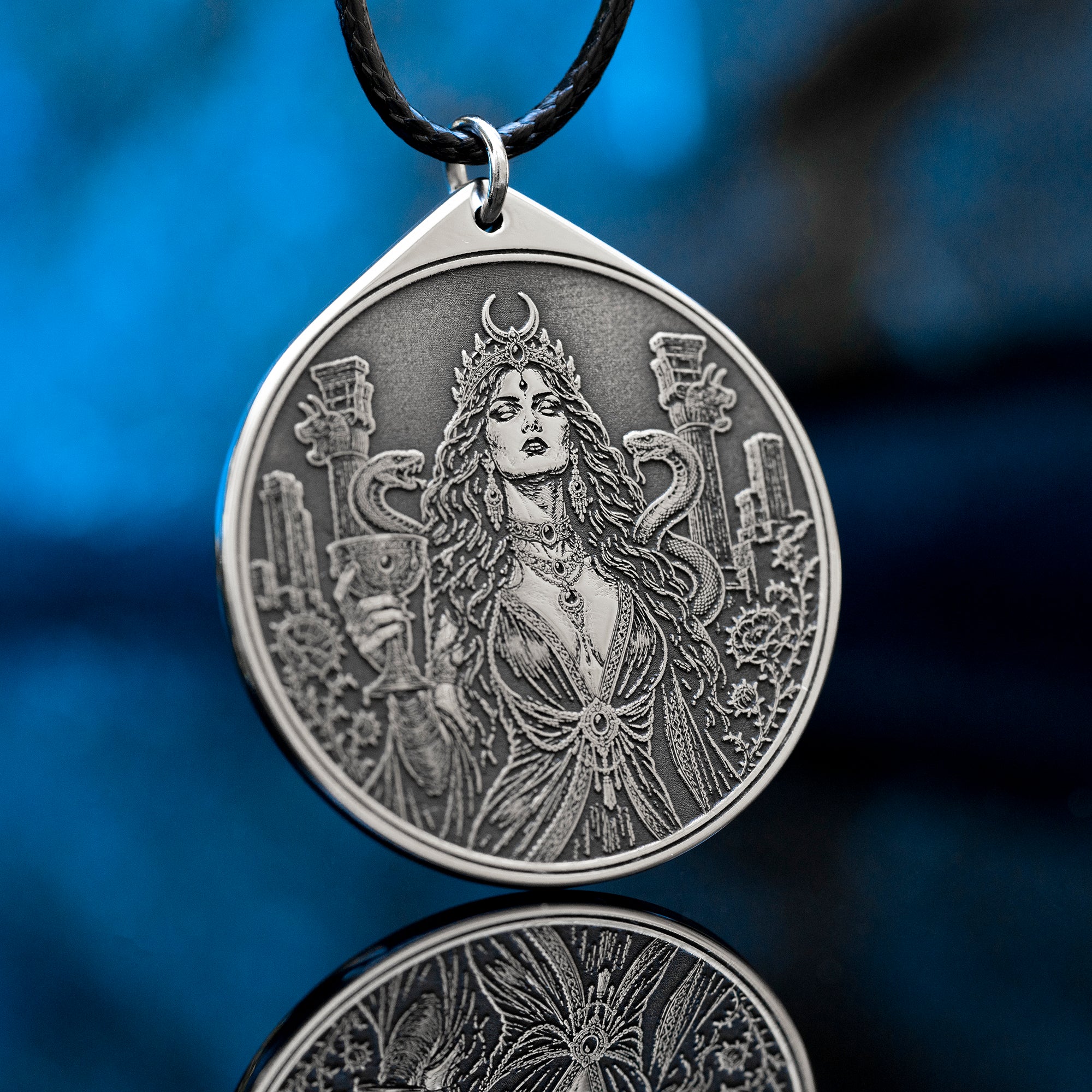 Az Jahi pendant with serpents, ritual chalice and crescent crown in black and white occult engraving style