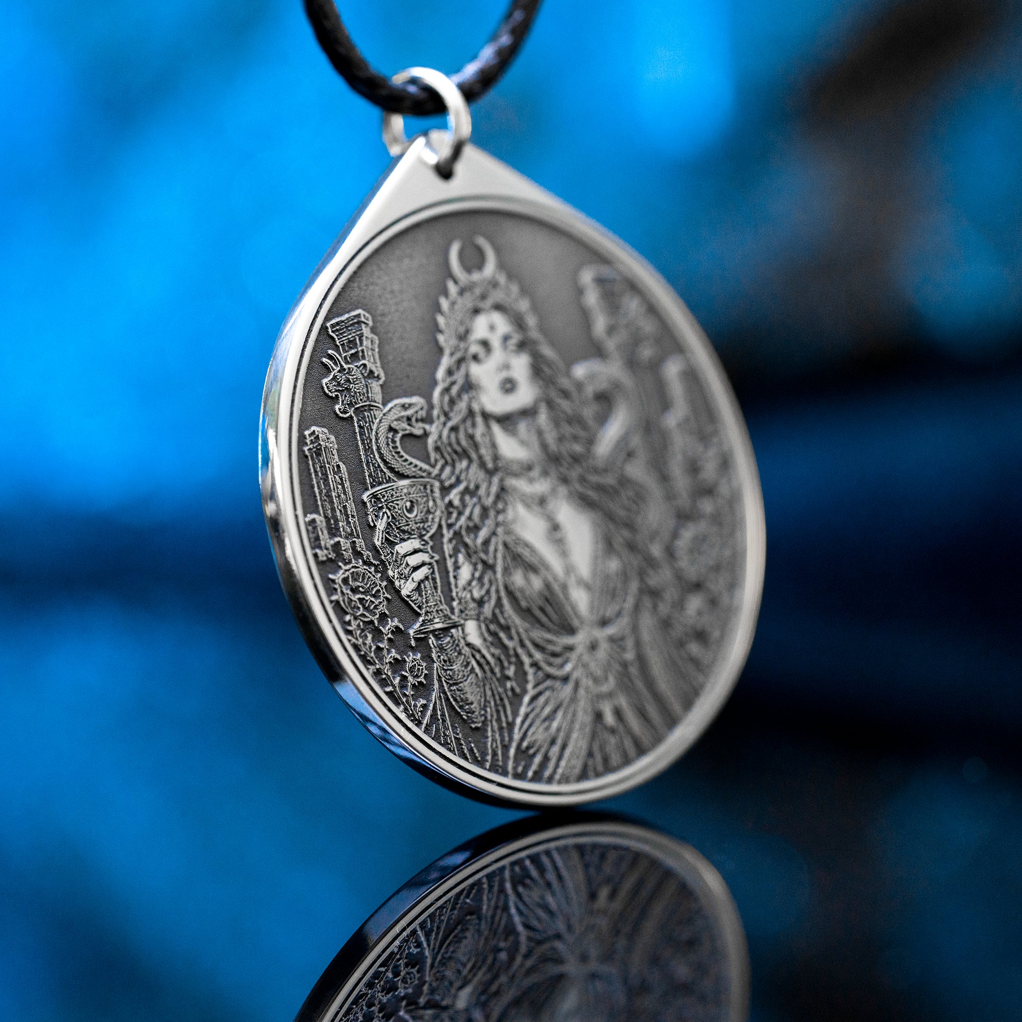 Az Jahi pendant with serpents, ritual chalice and crescent crown in black and white occult engraving style