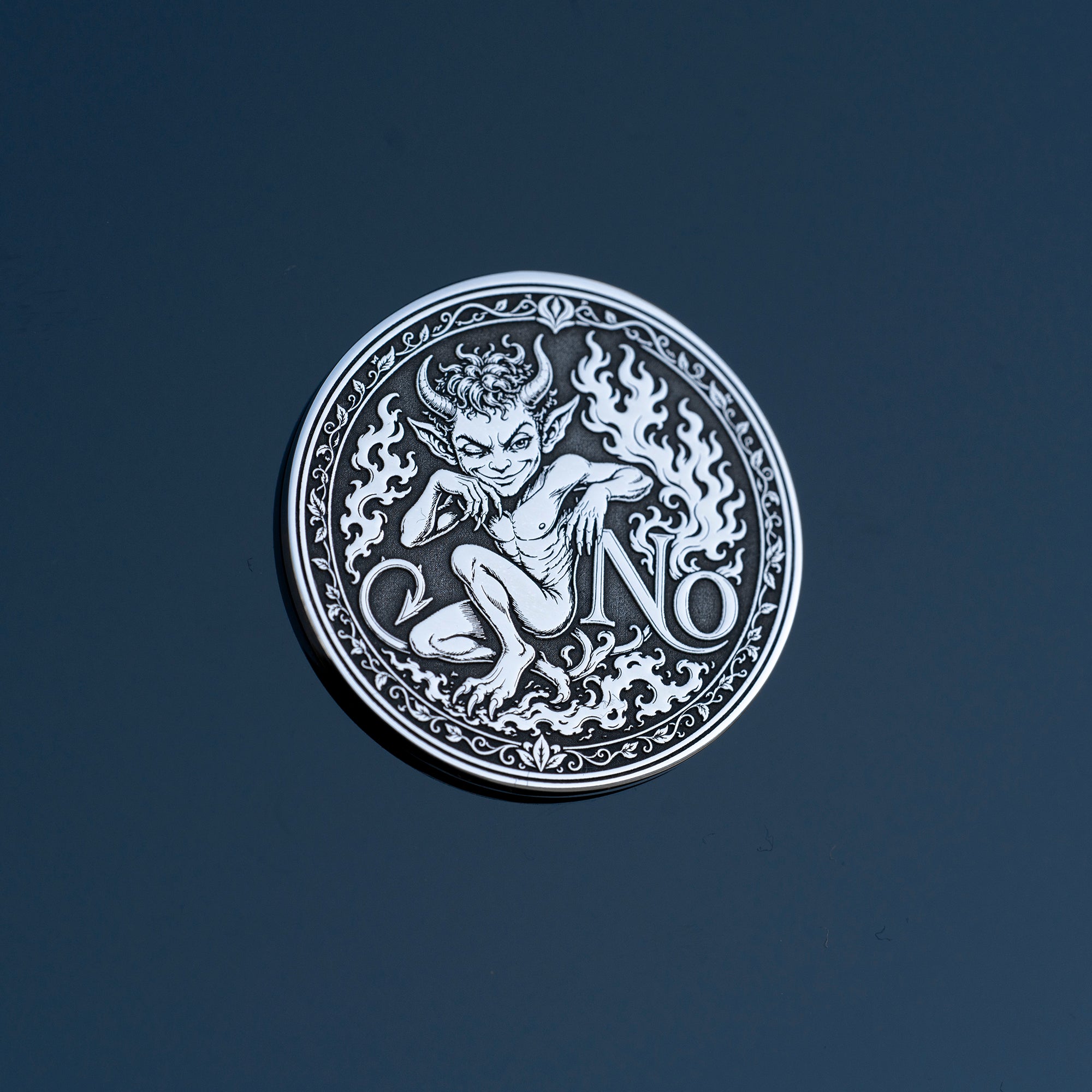 Double-sided fantasy decision coin with a nymph on the Yes side and an imp on the No side