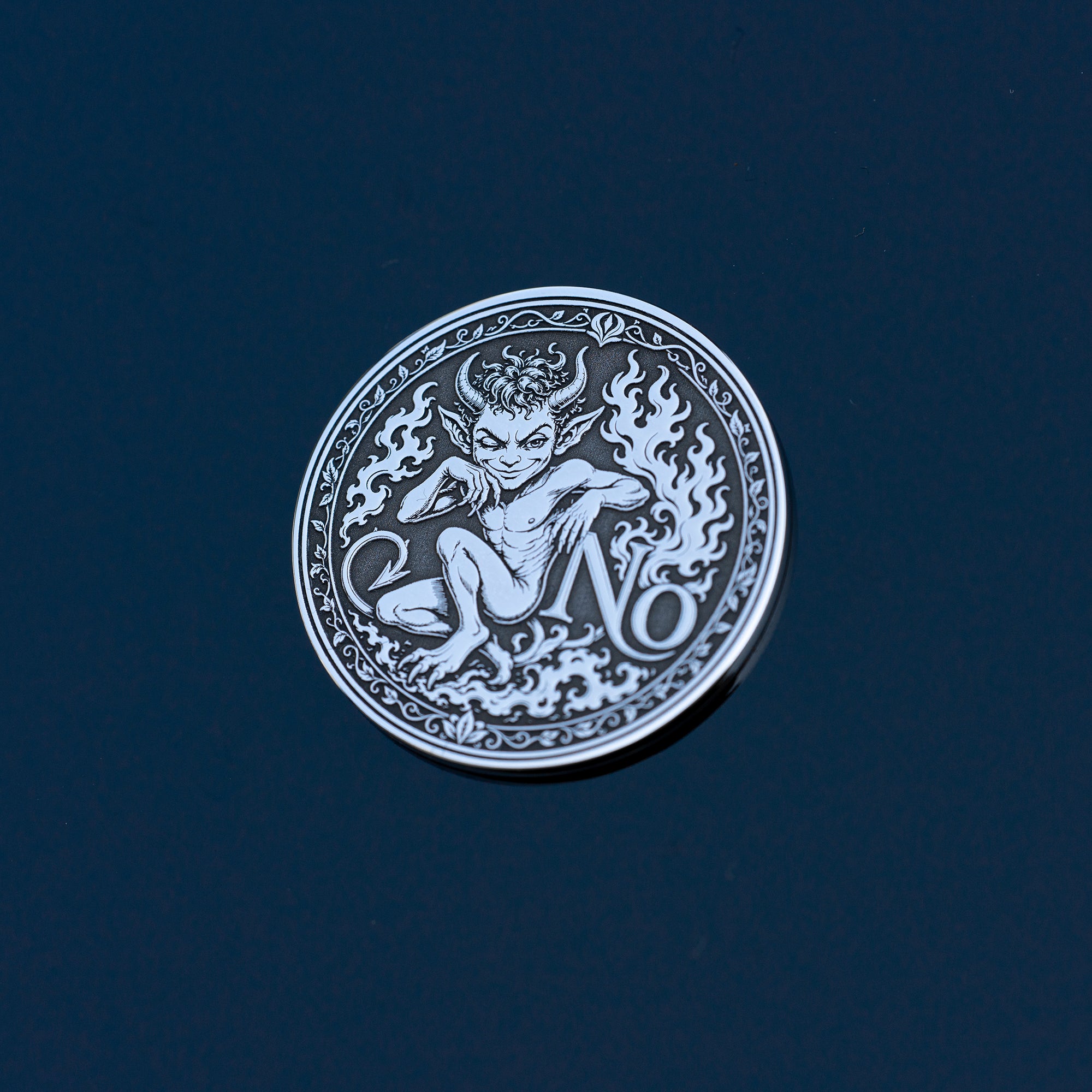 Double-sided fantasy decision coin with a nymph on the Yes side and an imp on the No side