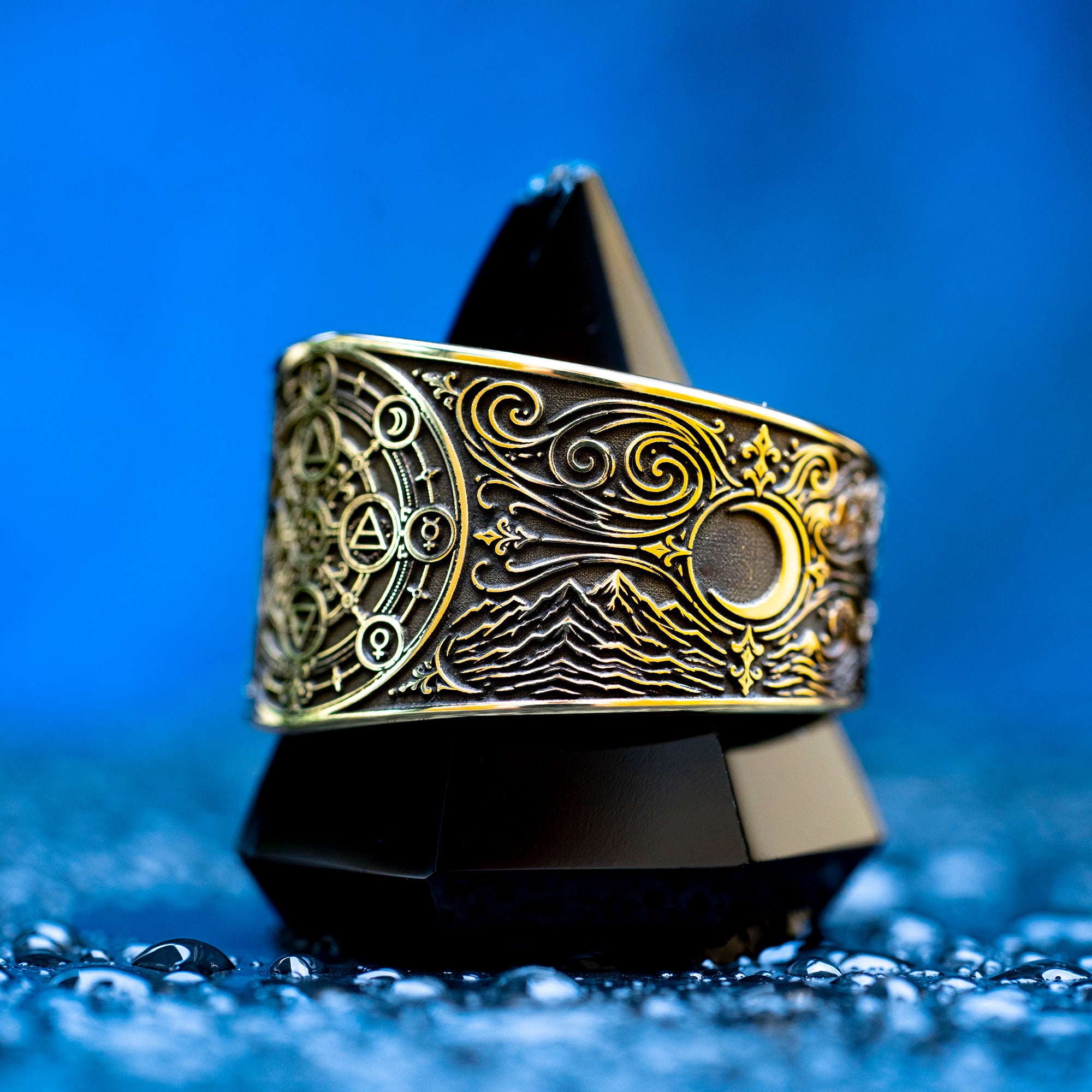 Gothic alchemical ring with Fire, Water, Air, Earth, seven planetary metal symbols, and detailed occult engraving