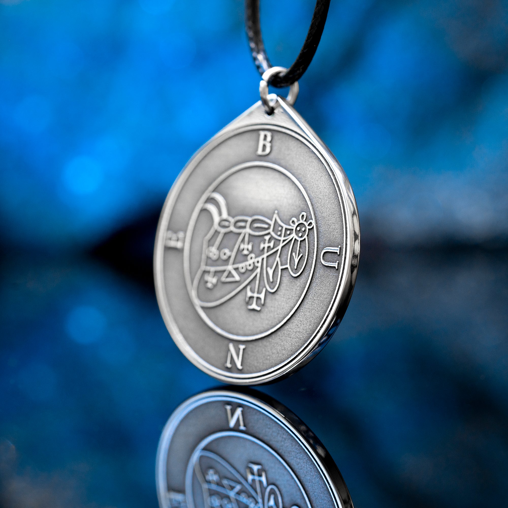 Bune seal pendant with Goetia demon sigil engraved on a dark occult amulet necklace