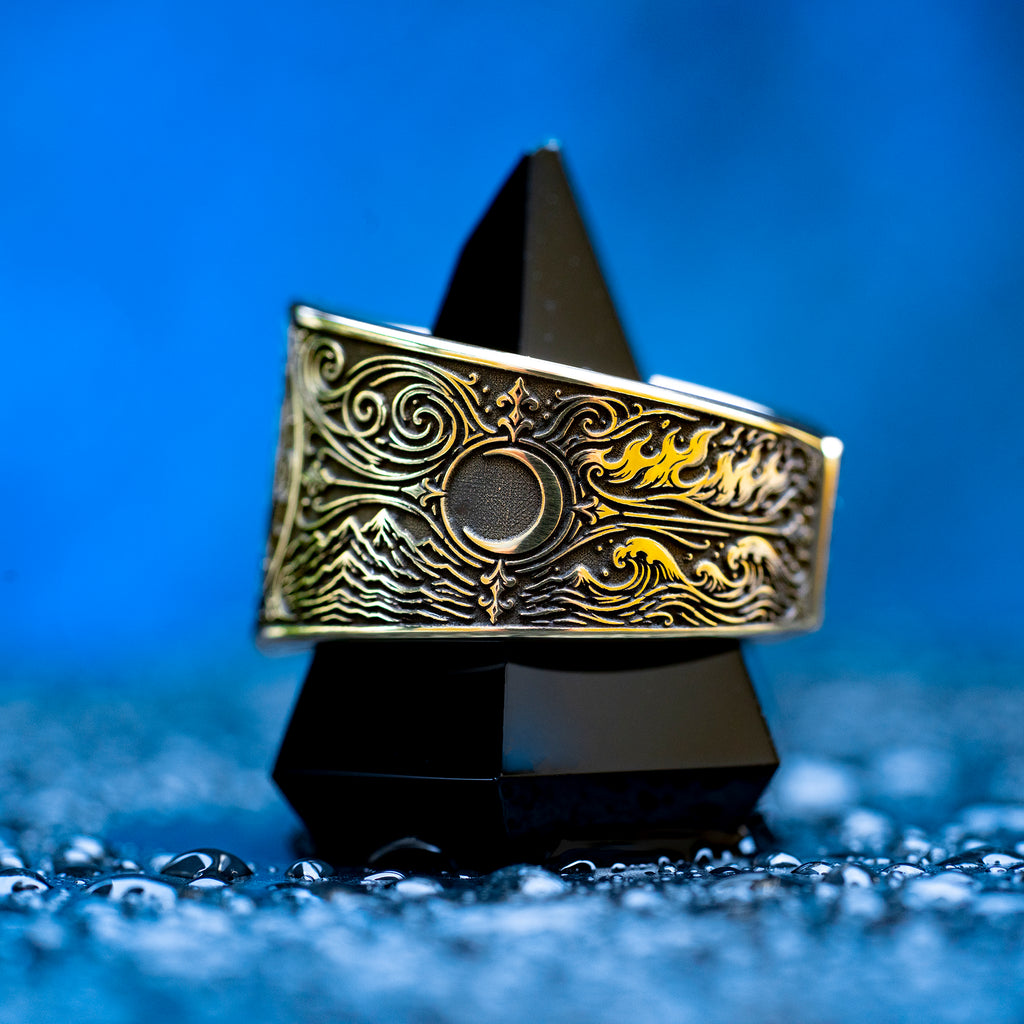 Gothic alchemical ring with Fire, Water, Air, Earth, seven planetary metal symbols, and detailed occult engraving
