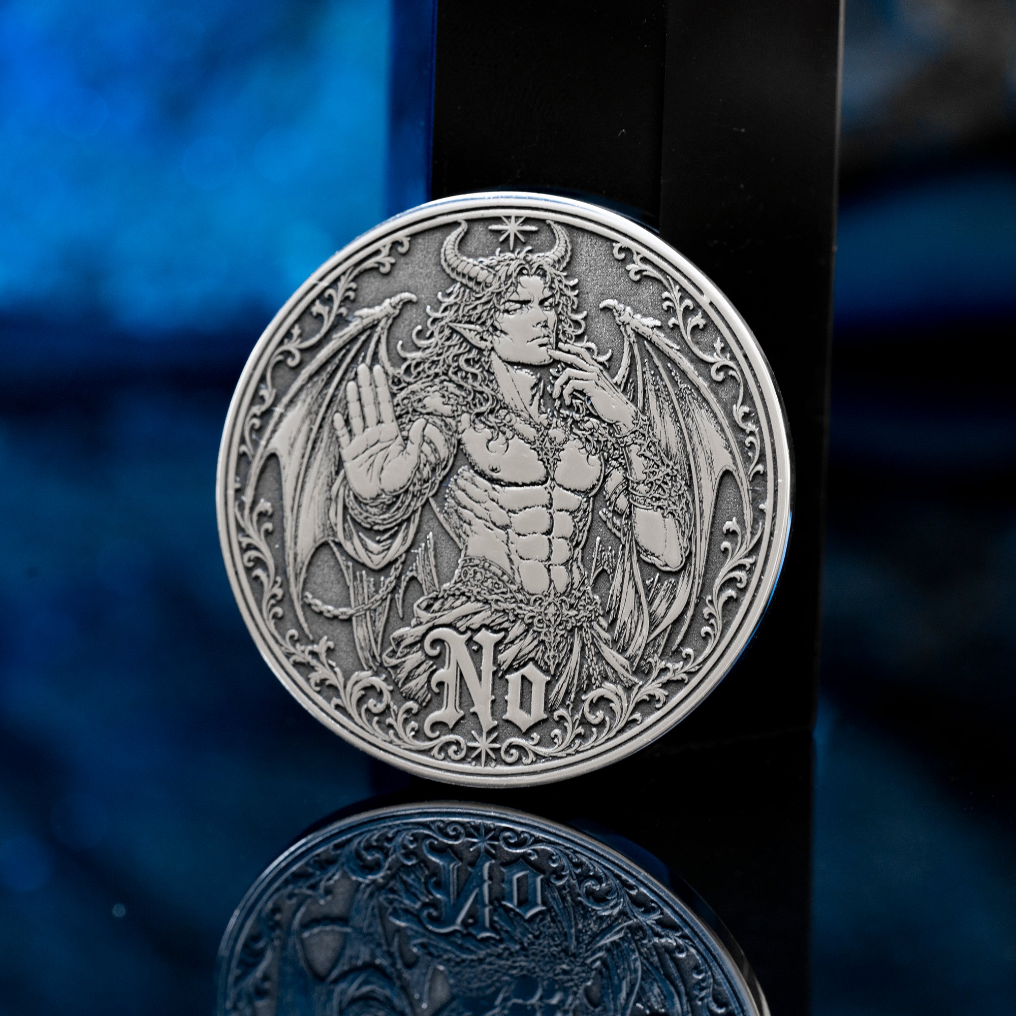 Double-sided angel demon decision coin with Yes and No sides for oracle-style choices